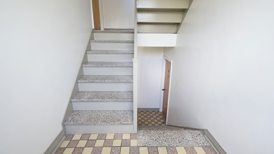 Interior painting of staircase in apartment building Villeray Montreal